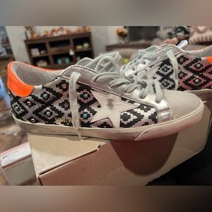 Authentic Golden Goose, comes with original bag and box and extra shoe laces.